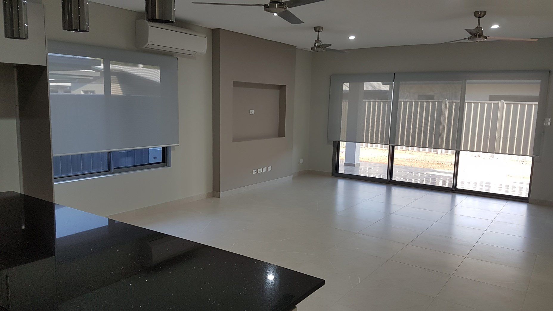 Empty Room With Ceiling Fans — Blinds Installation in Winnellie, NT