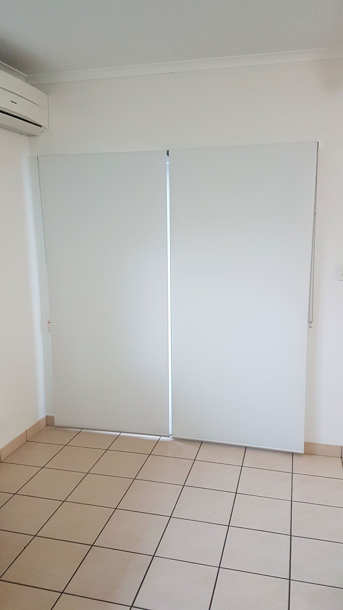 Tiled Floor And Rolled Down Blinds — Blinds Installation in Winnellie, NT