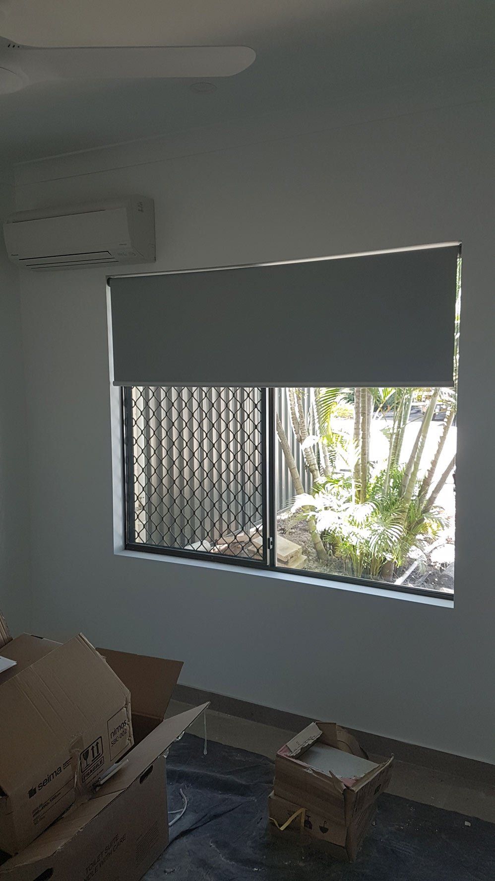 Boxes Near Window — Blinds Installation in Winnellie, NT