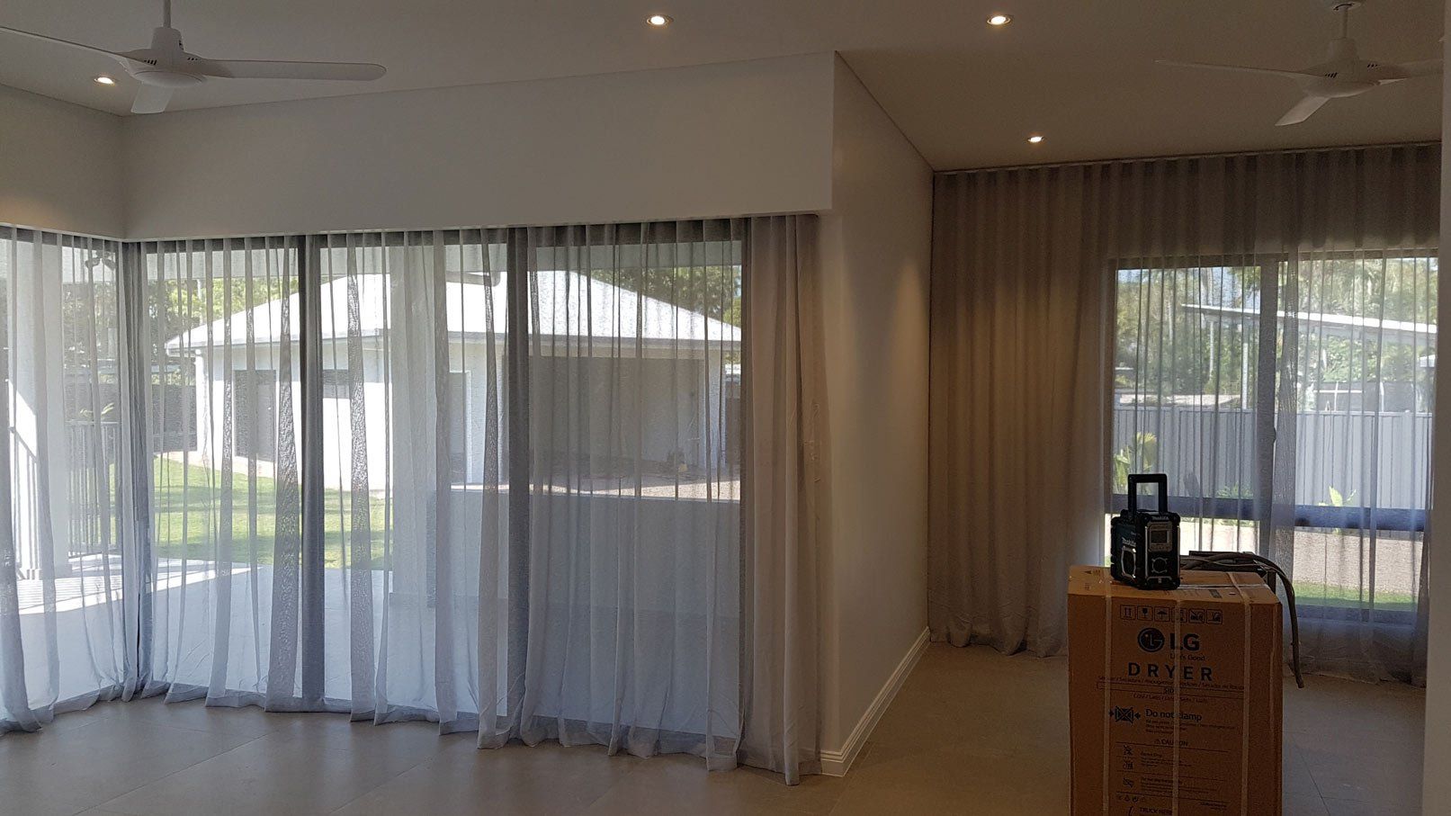 Curtains And Speaker On Top Of Box — Blinds Installation in Winnellie, NT