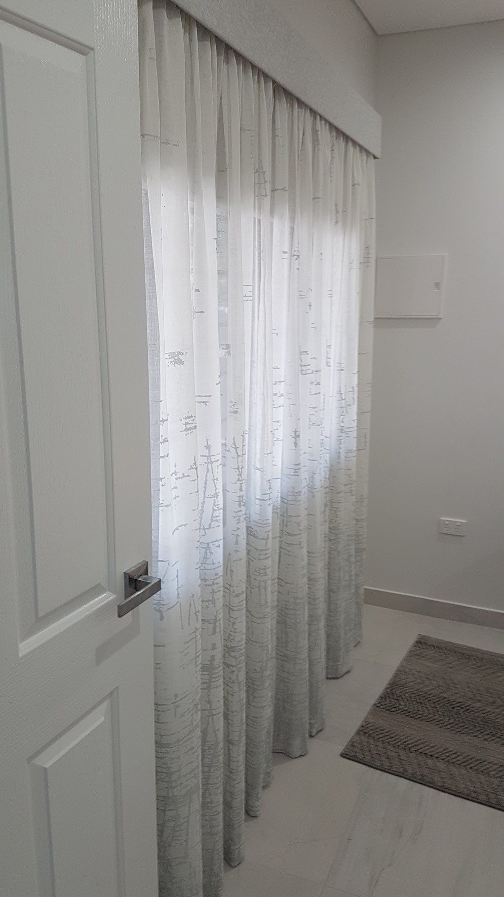 White Door And White Curtains — Blinds Installation in Winnellie, NT