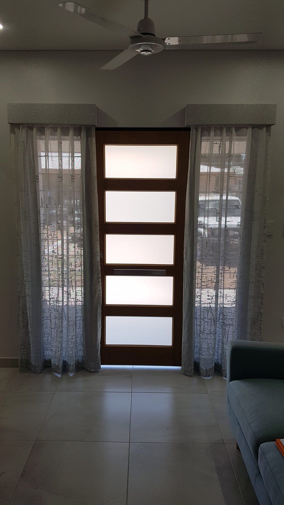 Door In Between Curtains — Blinds Installation in Winnellie, NT