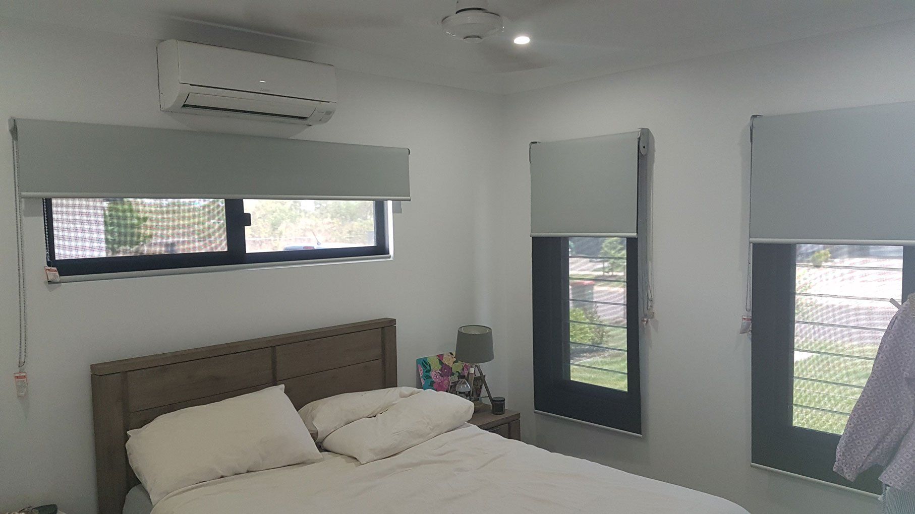 Bed With White Blanket And Pillows — Blinds Installation in Winnellie, NT