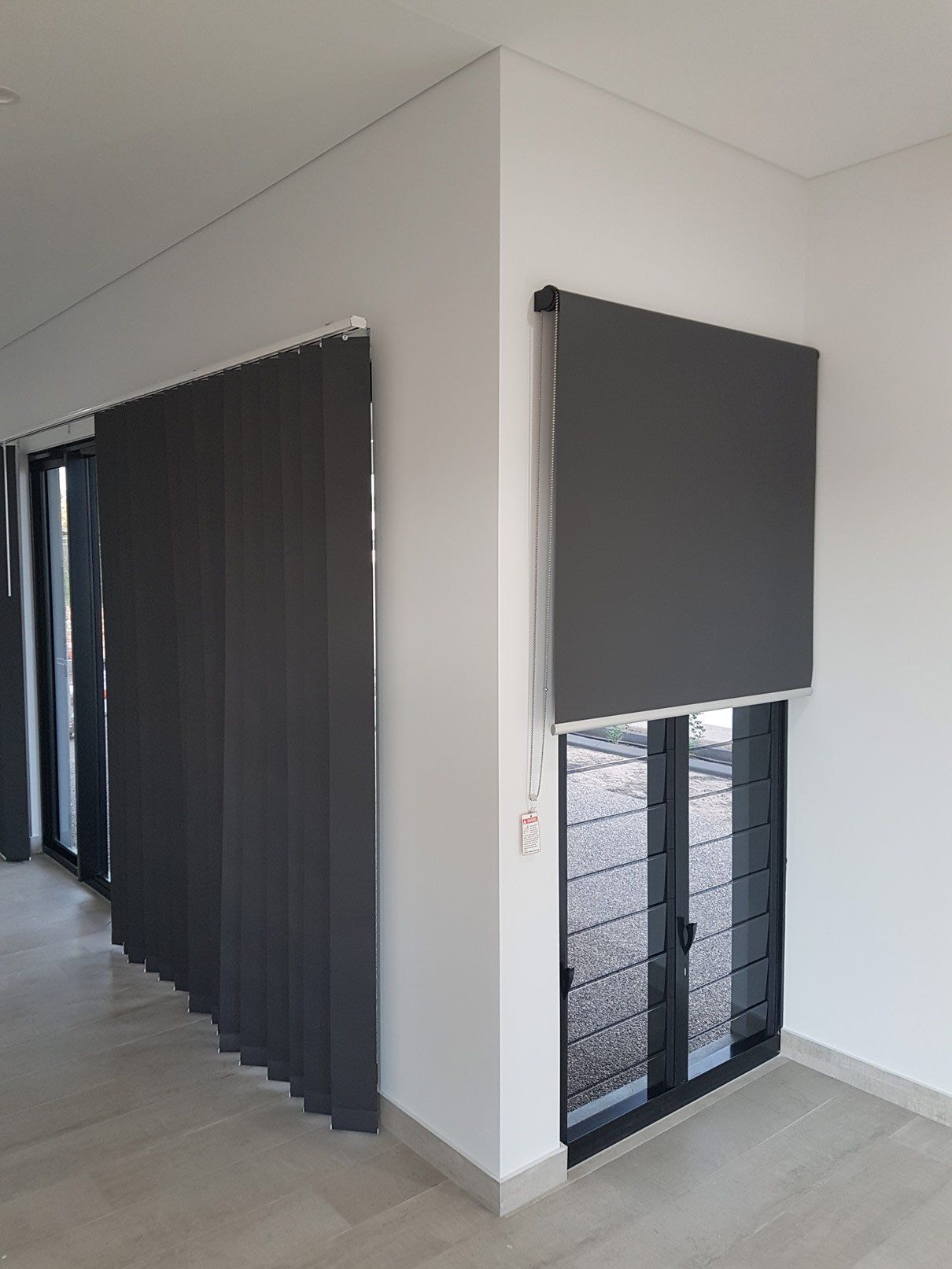 Jalousie Windows With Black Roller Blinds — Blinds Installation in Winnellie, NT