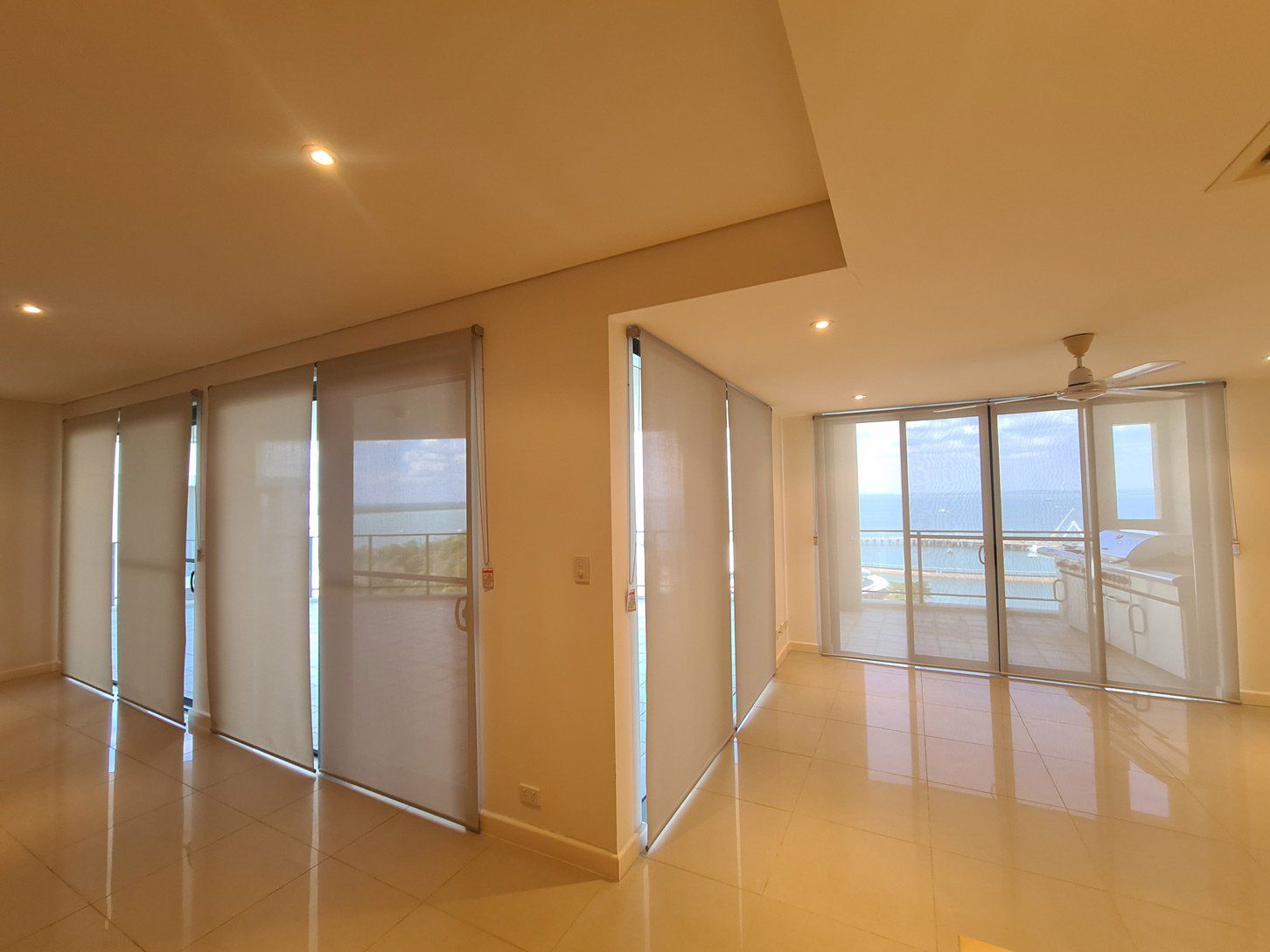 Room With Plenty Of Roller Blinds — Blinds Installation in Winnellie, NT