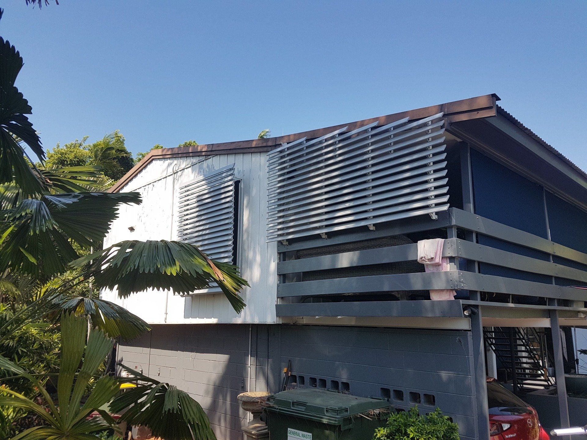 Metal louver awning over windows — Blinds Installation in Winnellie, NT