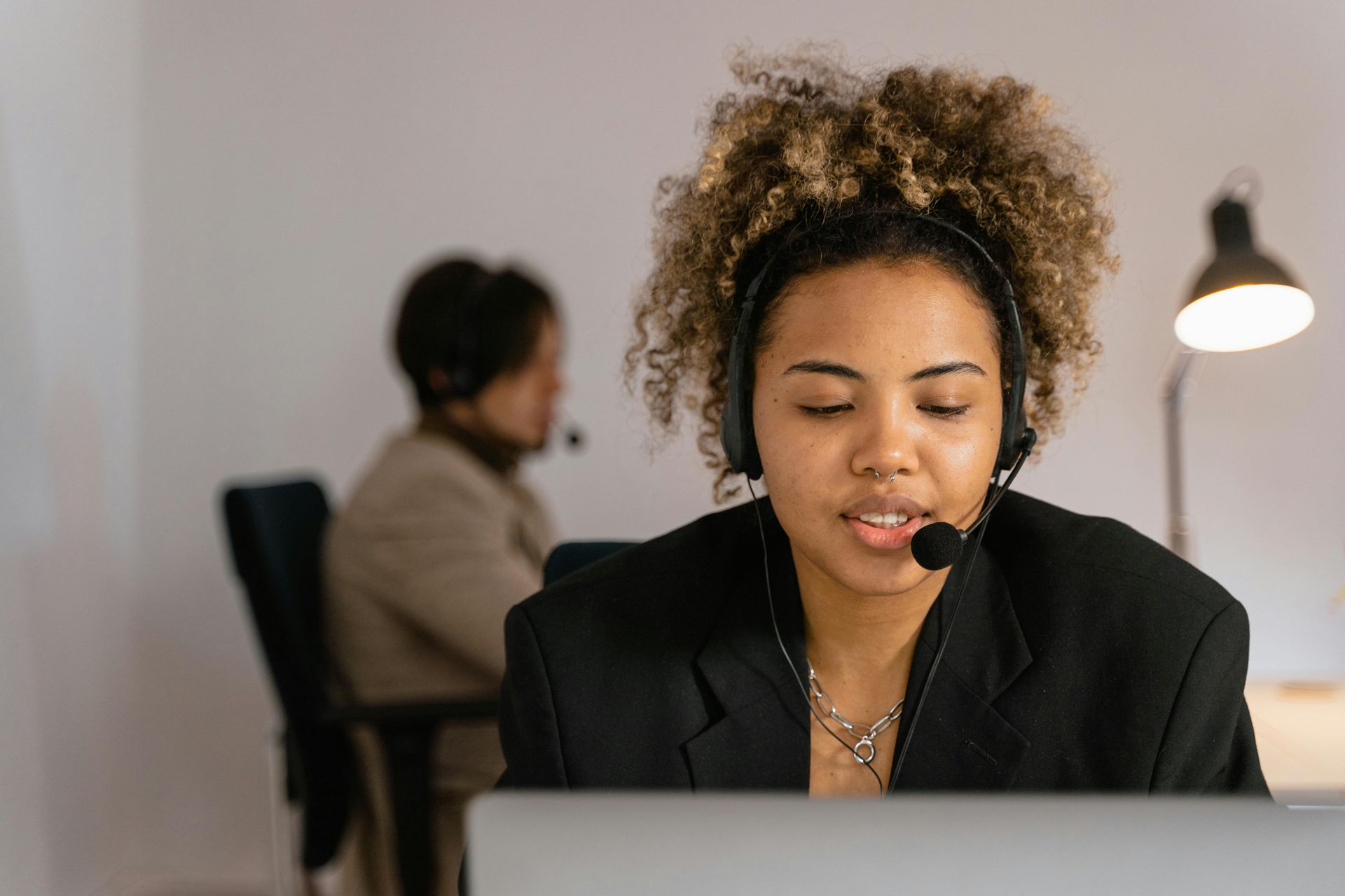 A Woman Is Sitting In Front Of A Laptop — Successful Resumes in Wonga Beach, QLD