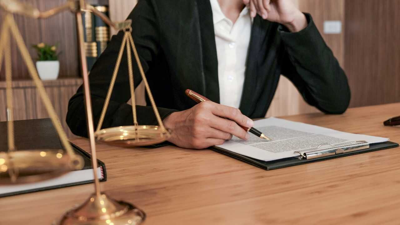 A lawyer sits at a desk