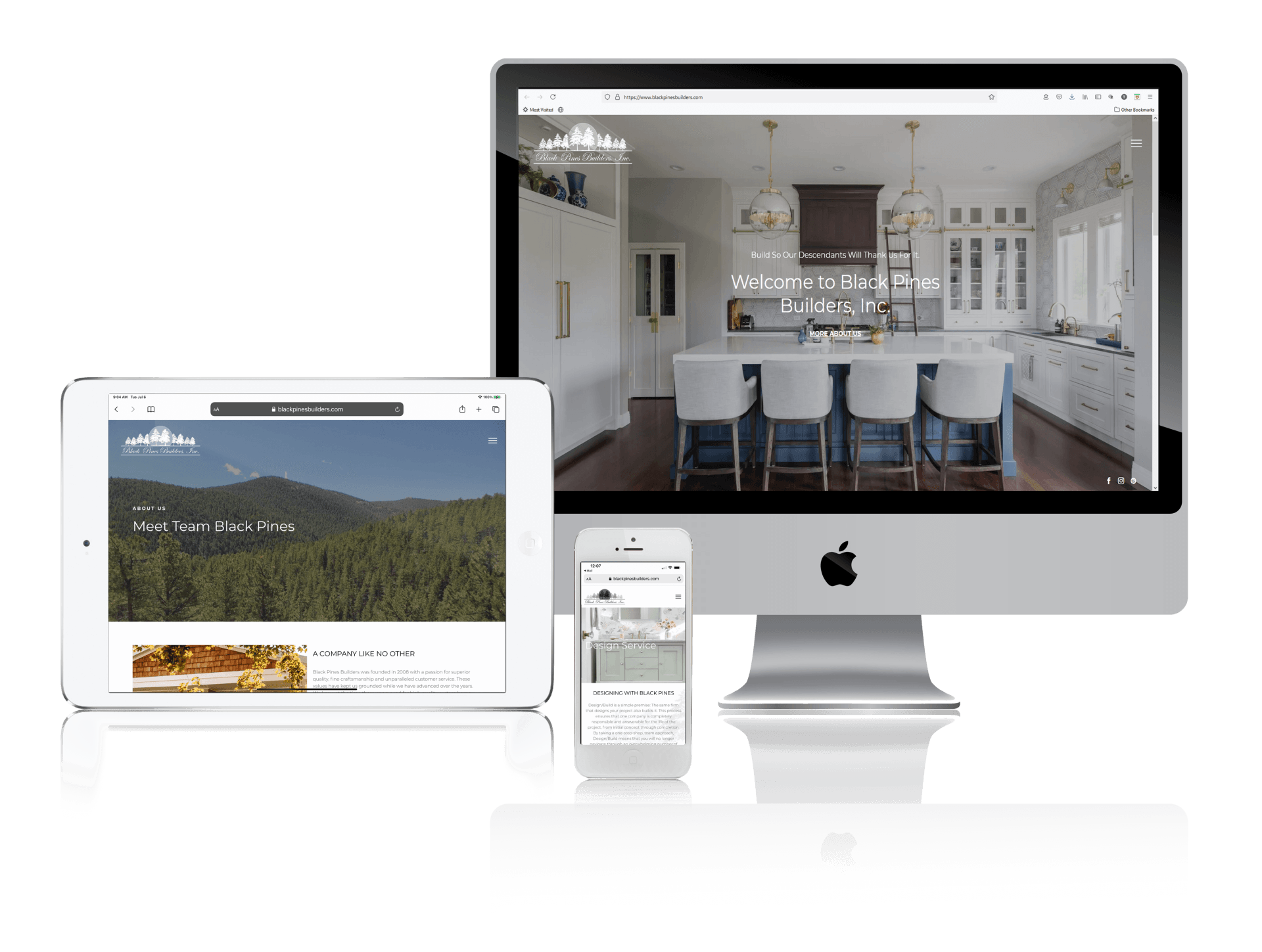 A computer , tablet , and cell phone are sitting next to each other on a table.