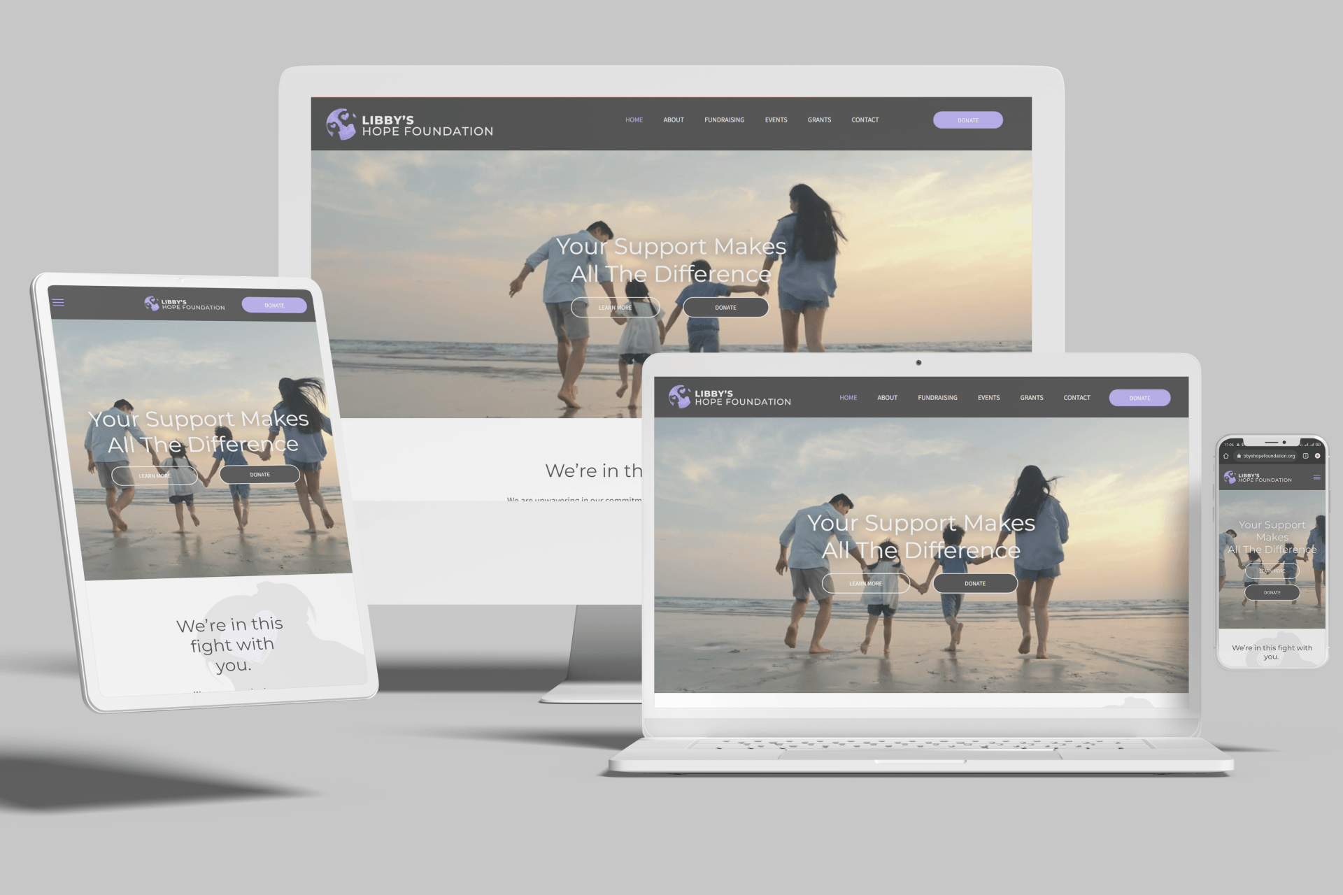 Family walking on beach at sunset, viewed on multiple devices: tablet, monitor, laptop, phone.