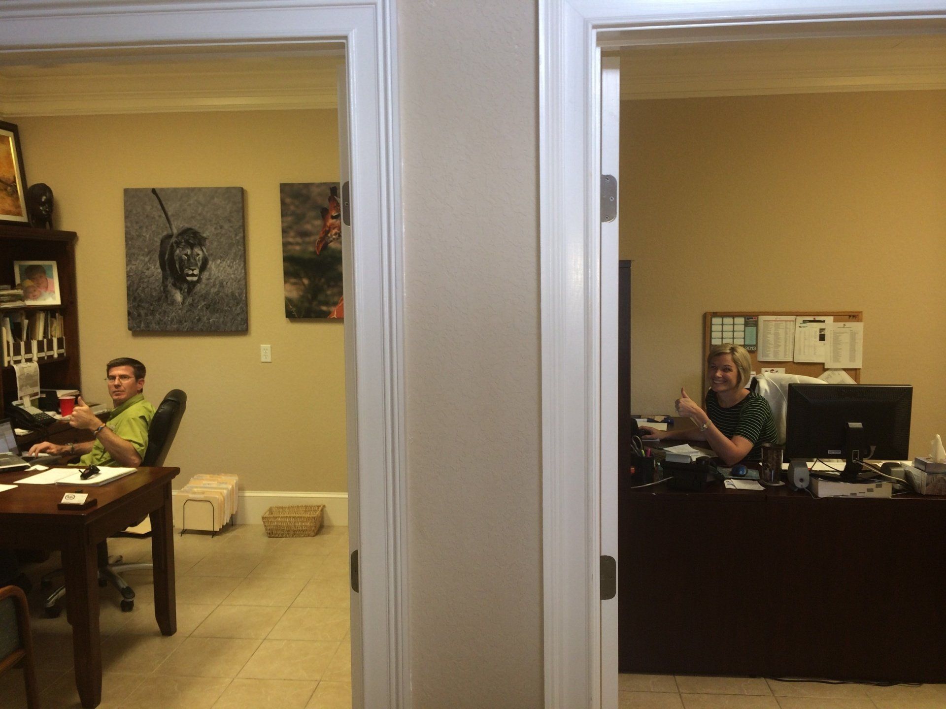 A man is sitting at a desk in an office