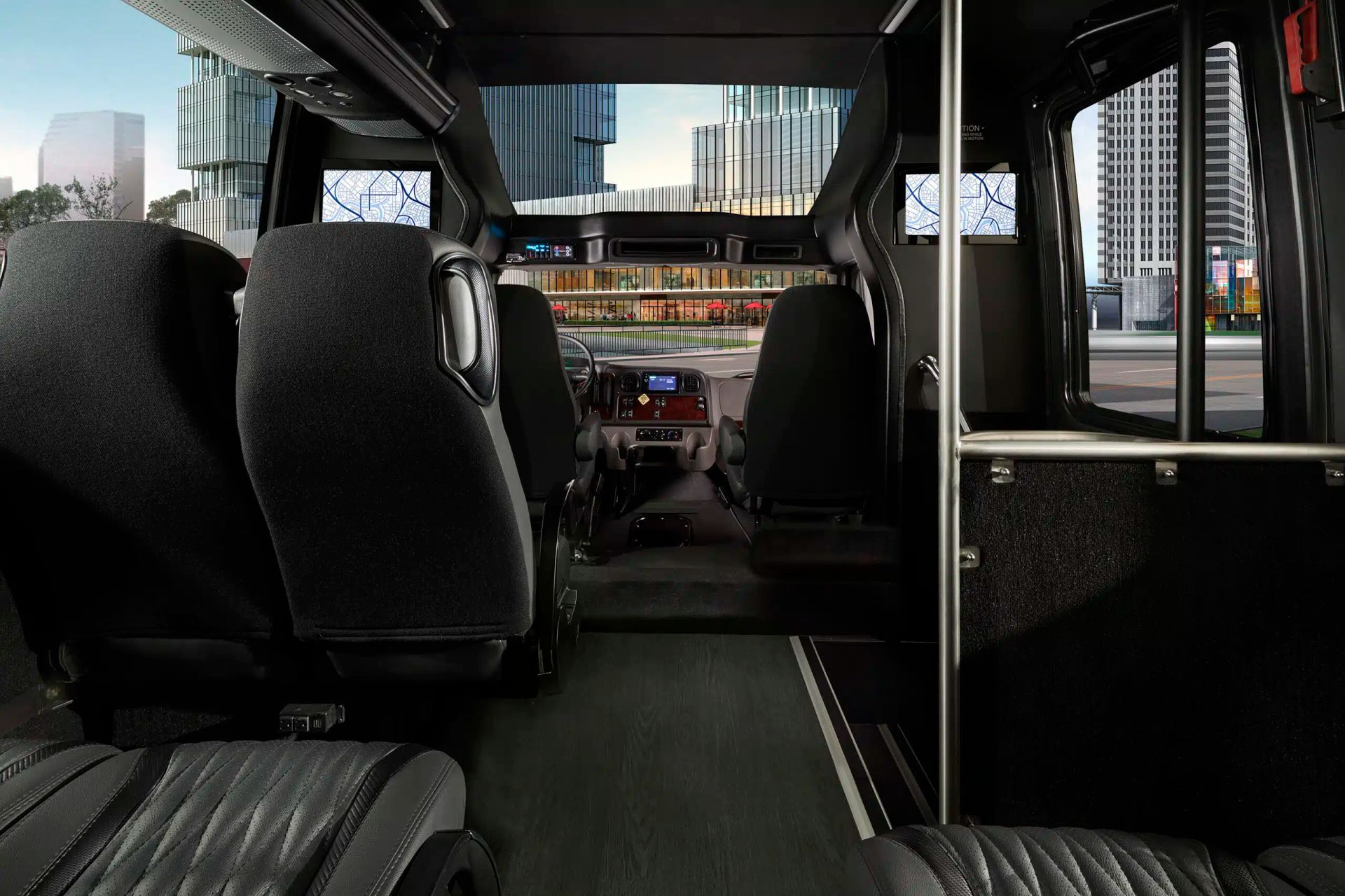 The inside of a bus with a city in the background