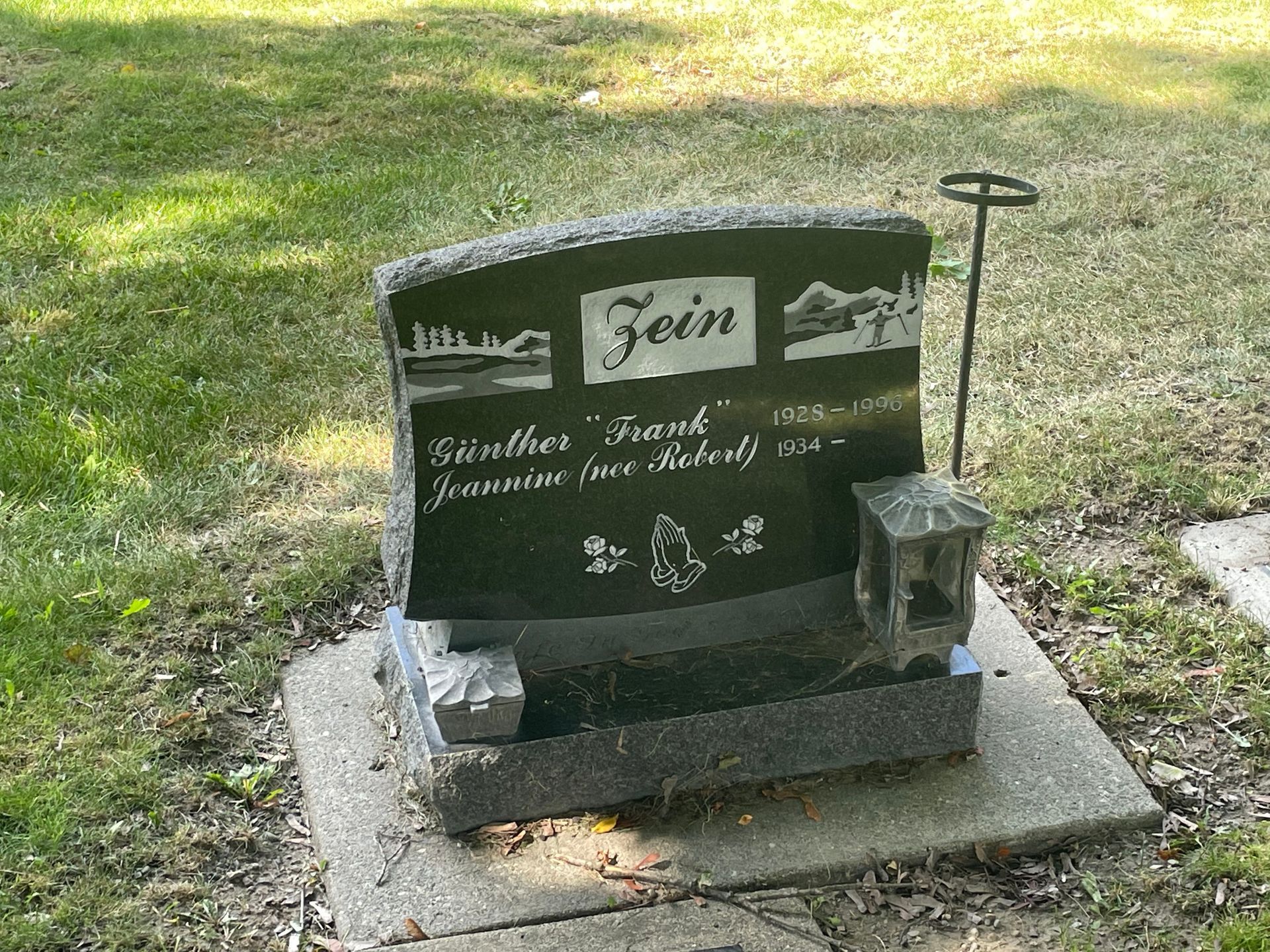 A black gravestone with the name fein on it