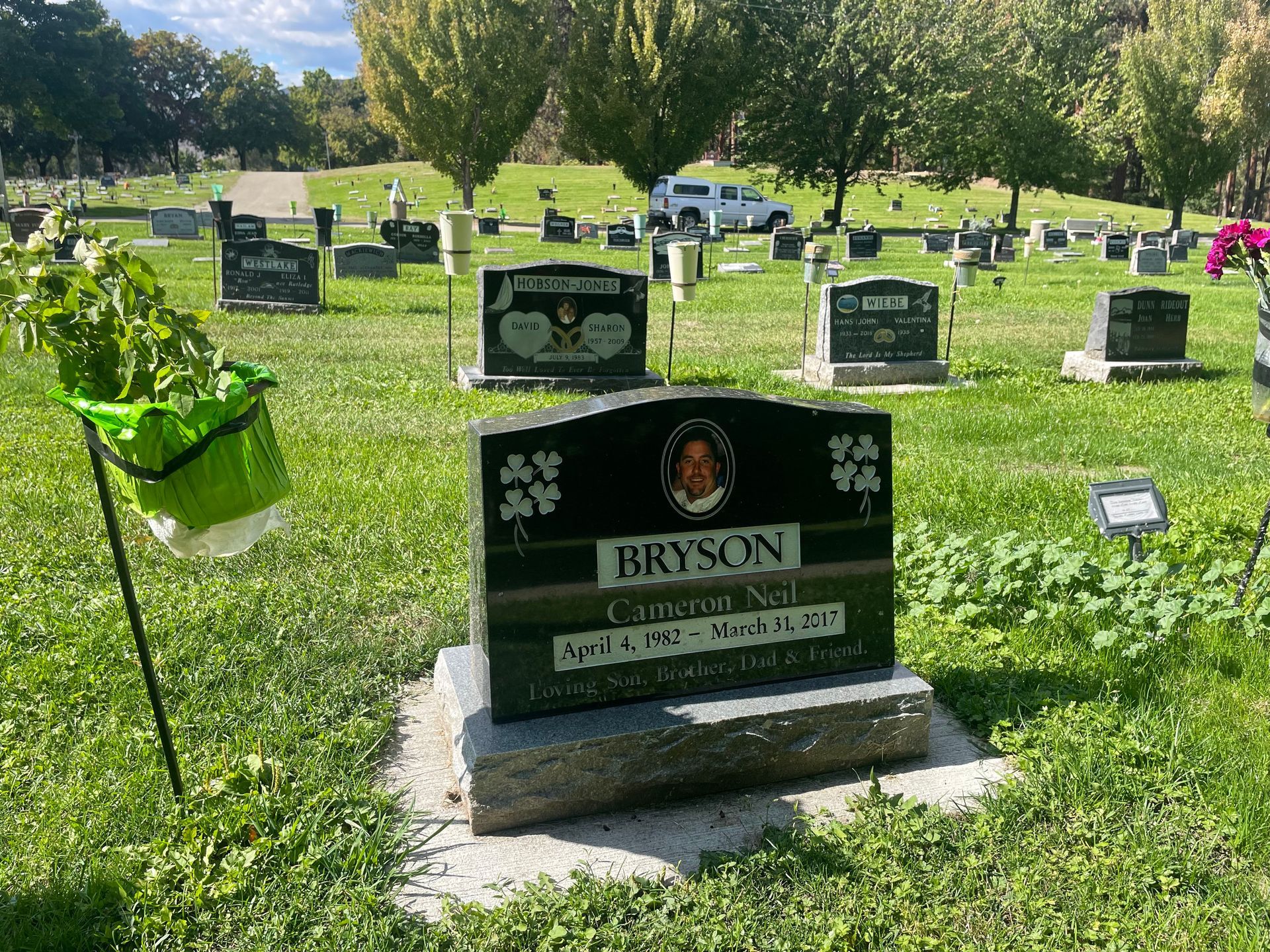 A cemetery with many graves and a gravestone for bryson.