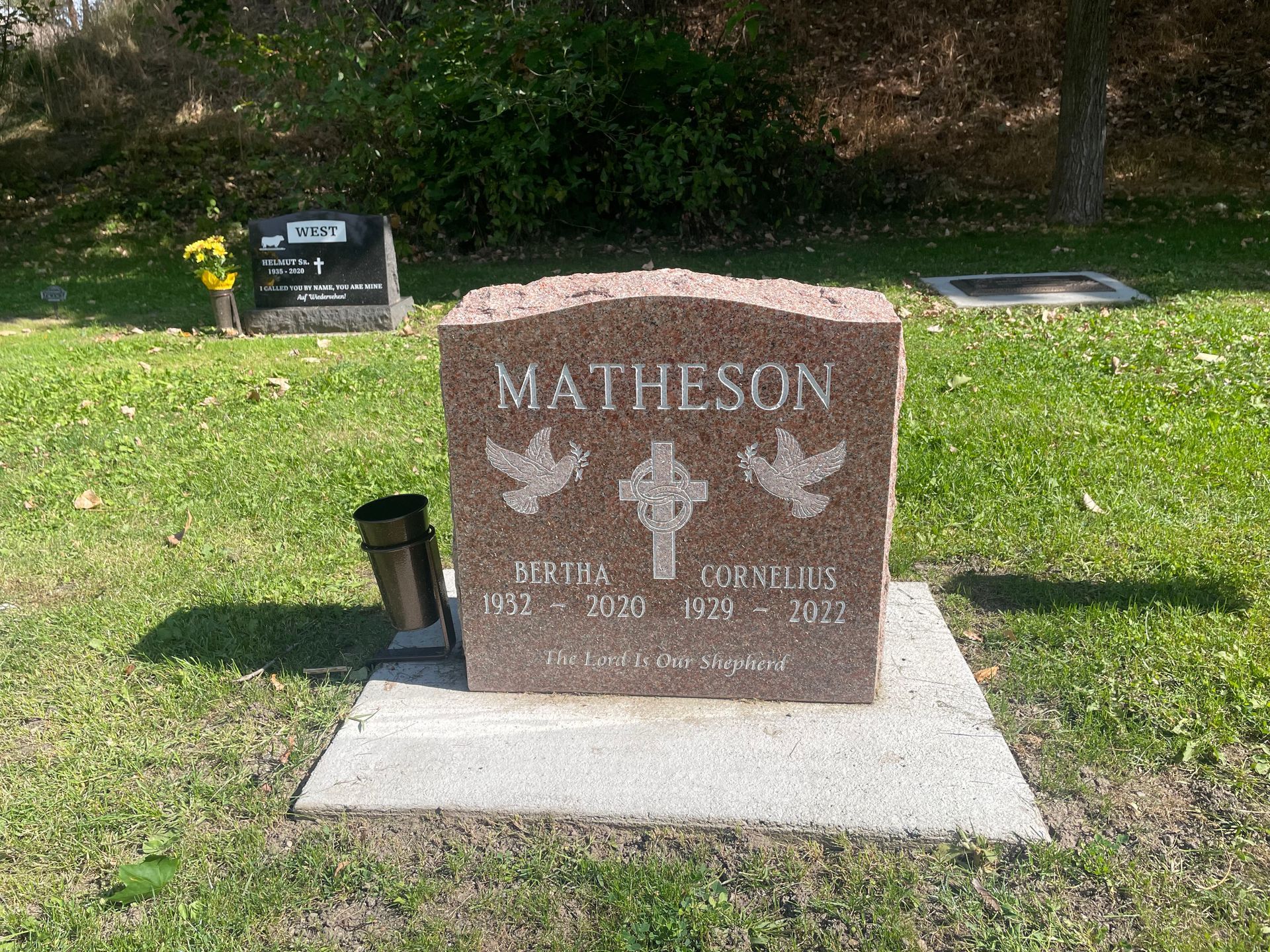 A gravestone for matheson is in a cemetery.
