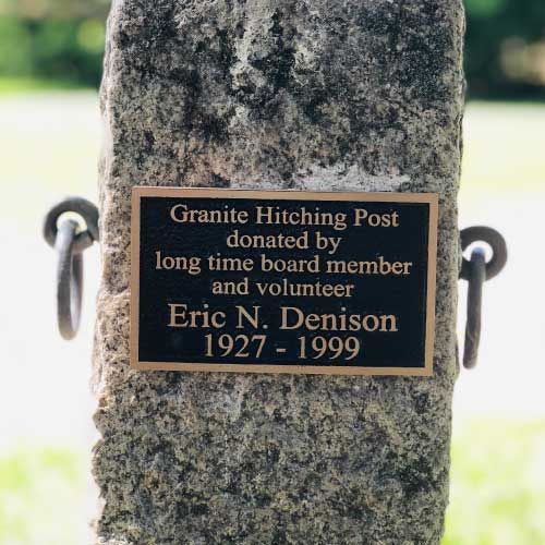 Granite hitching post donated by long time board member and volunteer eric n. denison 1927-1999