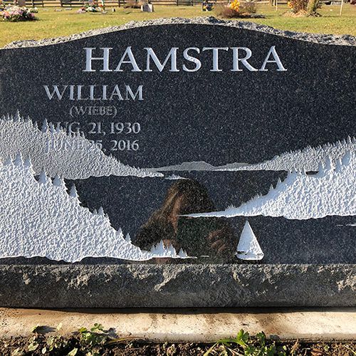 A gravestone for william hamstra is in a cemetery.
