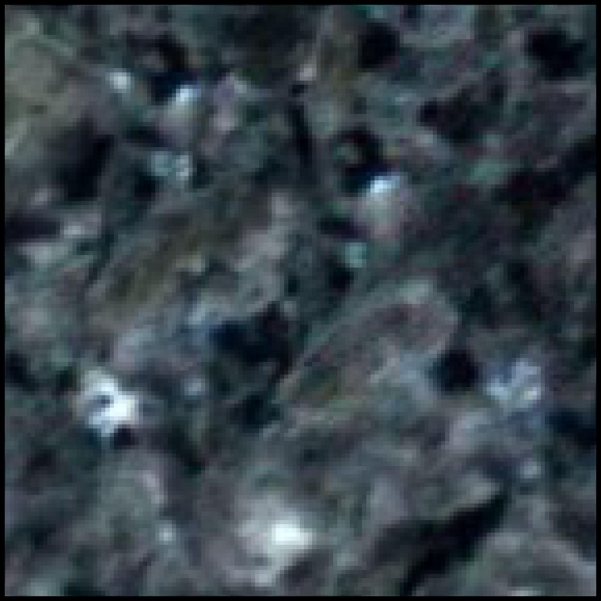 A close up of a rocky surface with a blurred background.