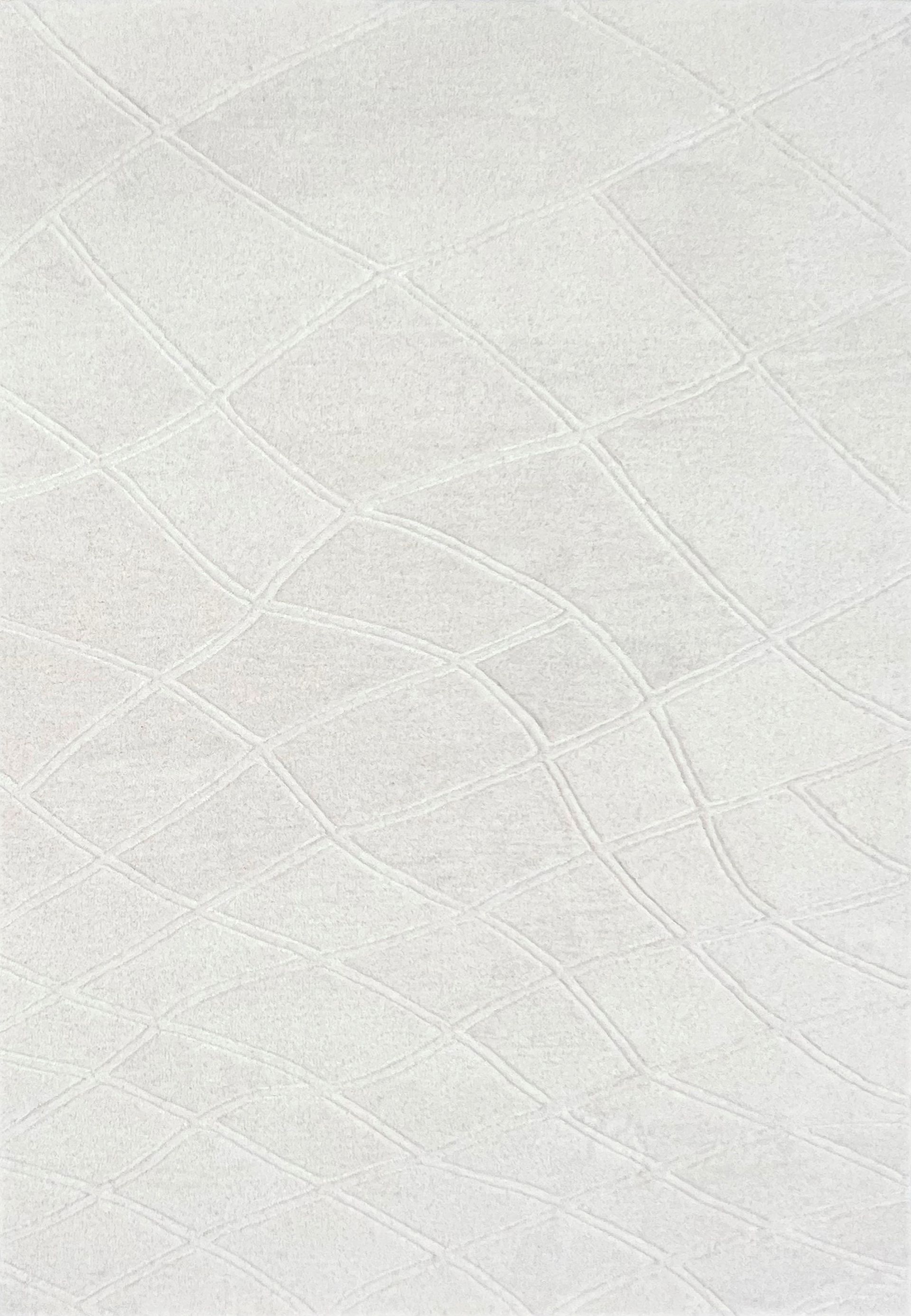 A variety of carpet samples are displayed on a table.