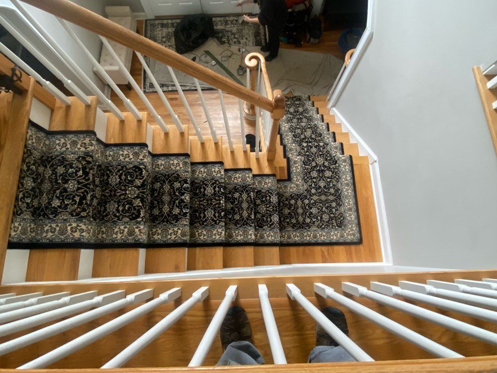 A person standing on a set of stairs looking down