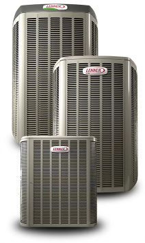 Three air conditioners are sitting next to each other on a white background.