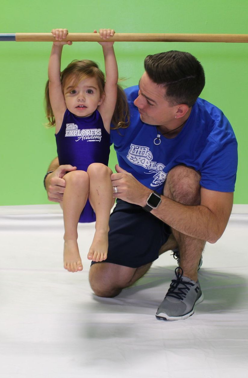 young cheerleader with coach