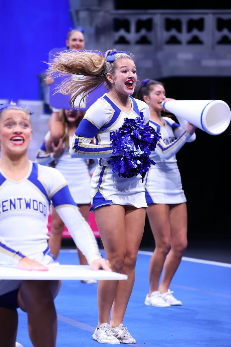 A group of cheerleaders are wearing entwood uniforms