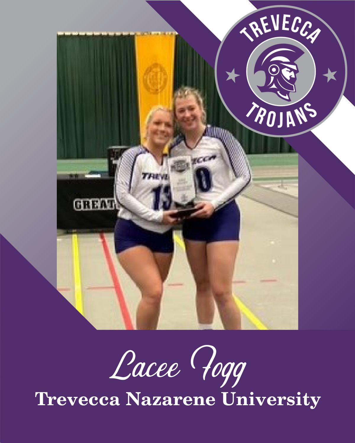 Two women are standing next to each other on a volleyball court holding a trophy.