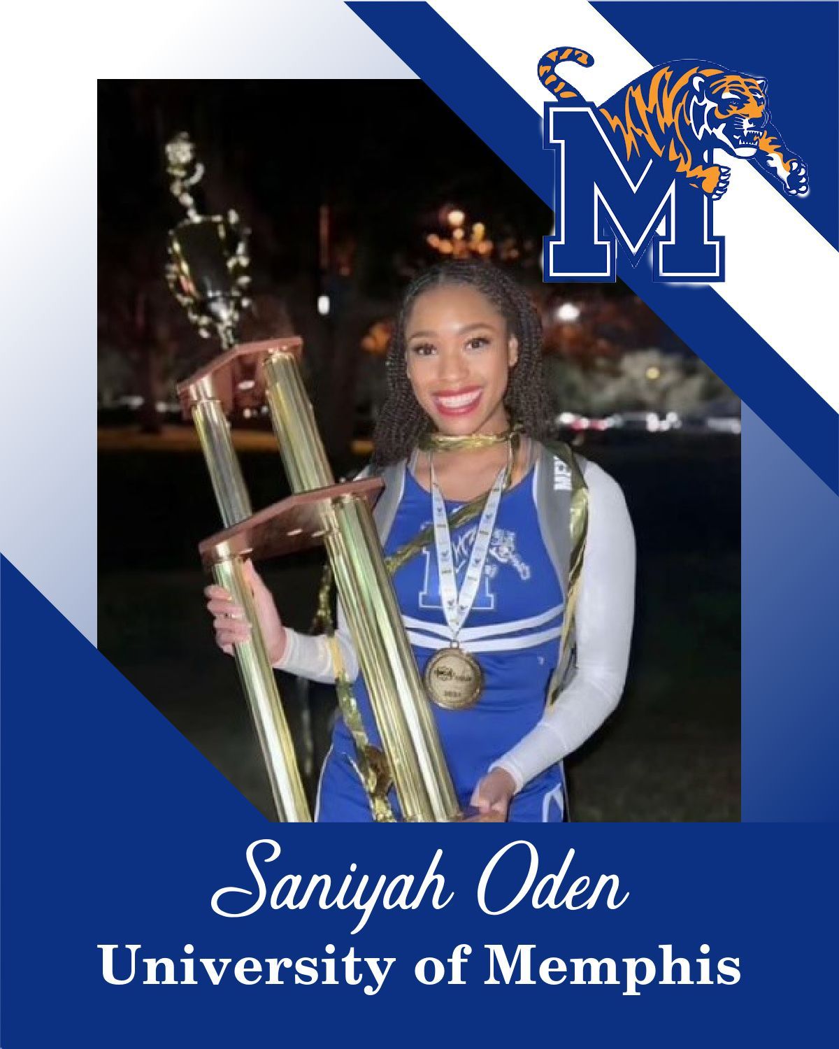 A cheerleader from university of memphis is holding a trophy