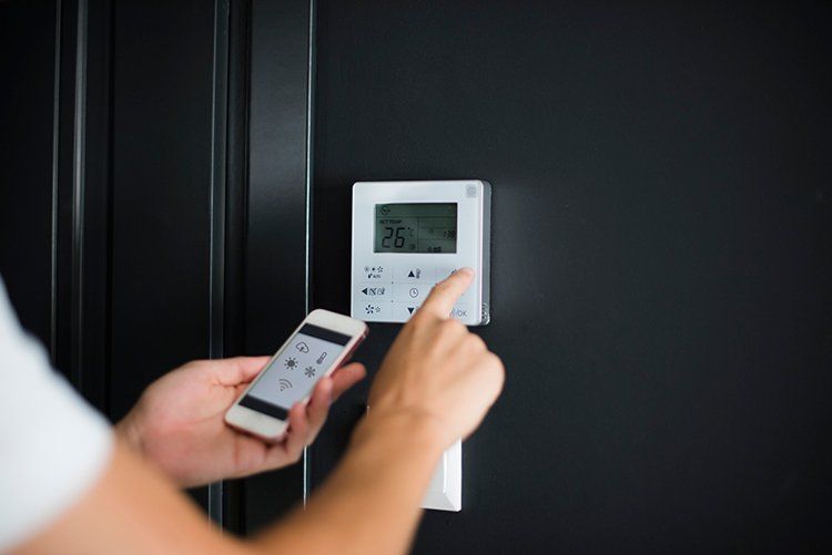 Using Smart Phone to Adjust the Thermostat — Land O’ Lakes, FL — Vortex Heating & Cooling