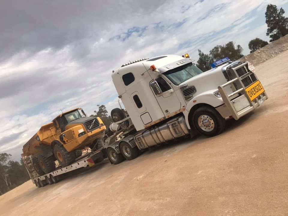Two Yellow Tractors Are Parked Next to Each Other on A Sunny Day — Albury Demolitions in Yarrawonga, NSW