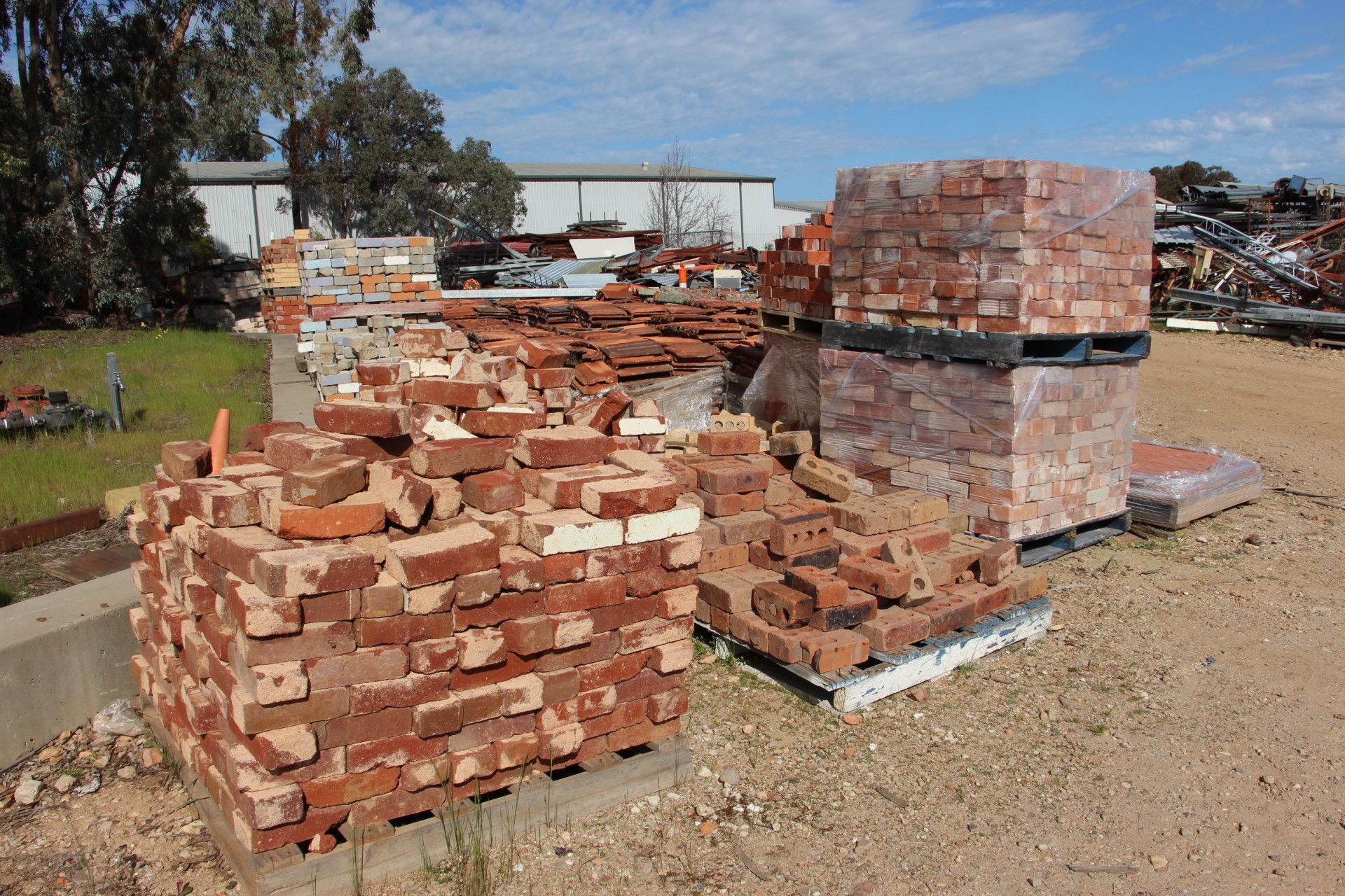 A Pile Of Bricks in A Dirt Field — Albury Demolitions in Lavington, NSW
