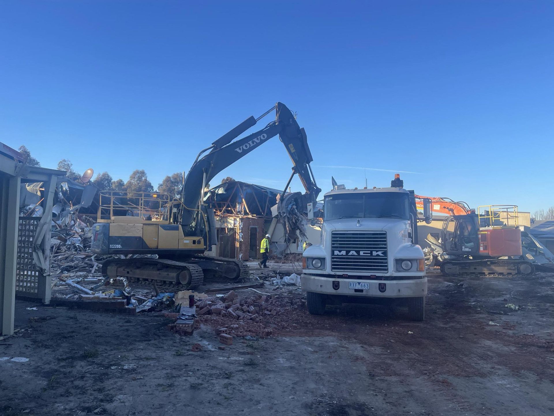 A Large Building Is Being Demolished by A Bulldozer — Albury Demolitions in Yarrawonga, NSW