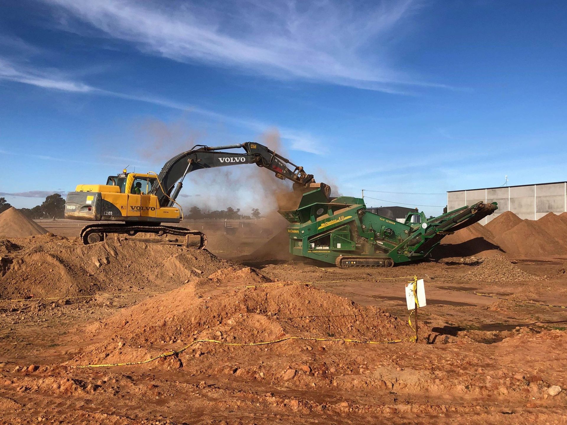 A Bulldozer Is Digging a Hole in The Ground — Albury Demolitions in Yarrawonga, NSW