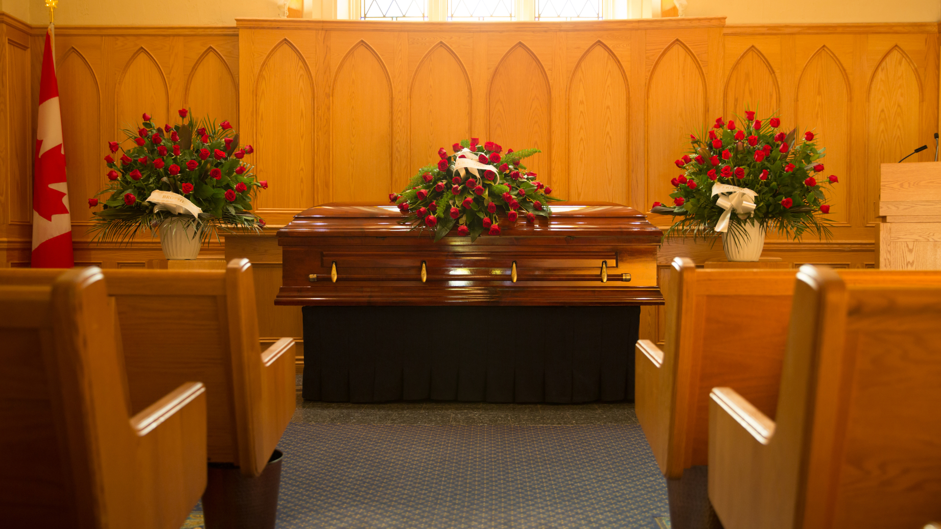 There is a coffin in the middle of the church.