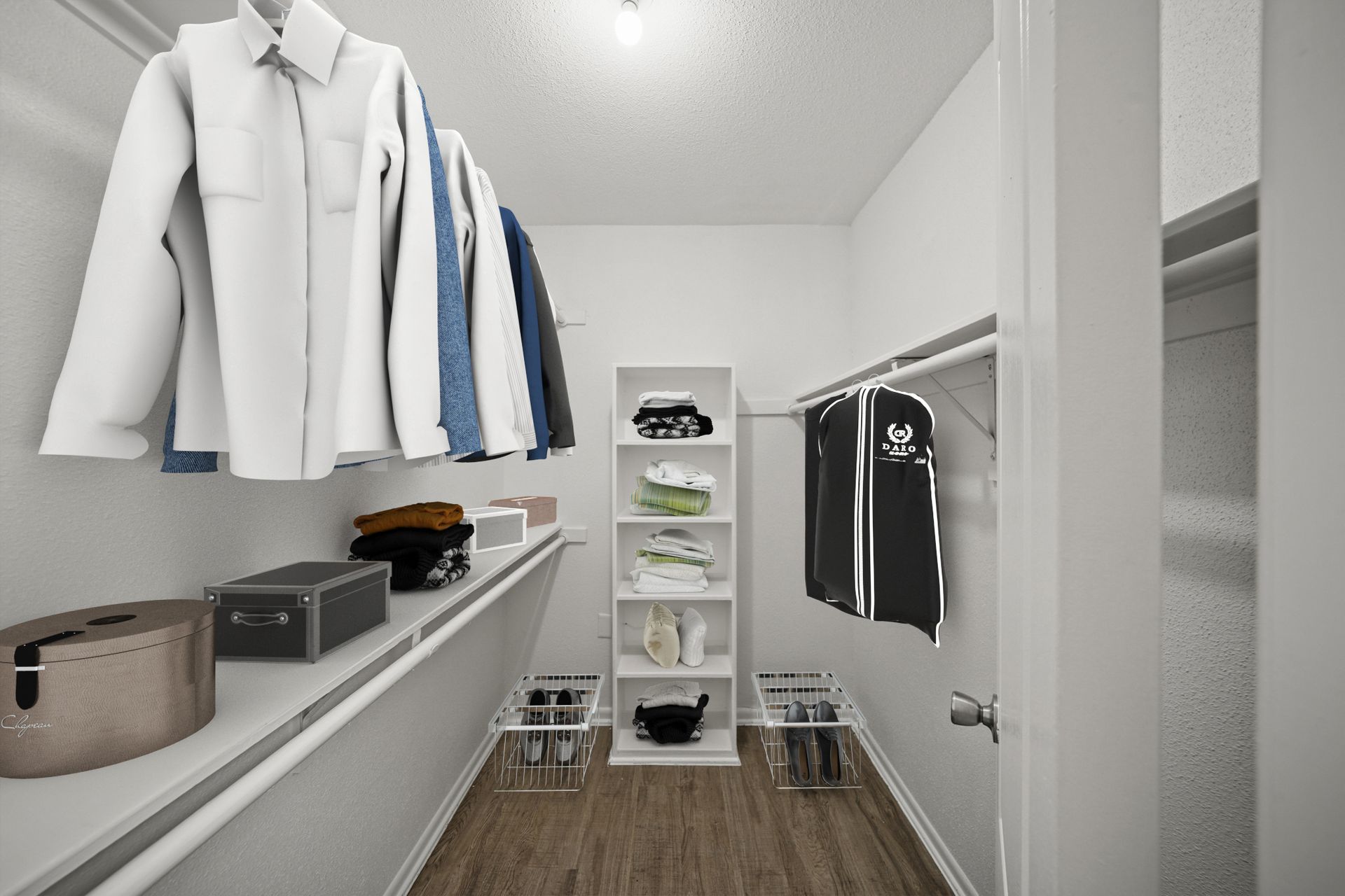 A walk in closet with clothes hanging on racks and shelves.