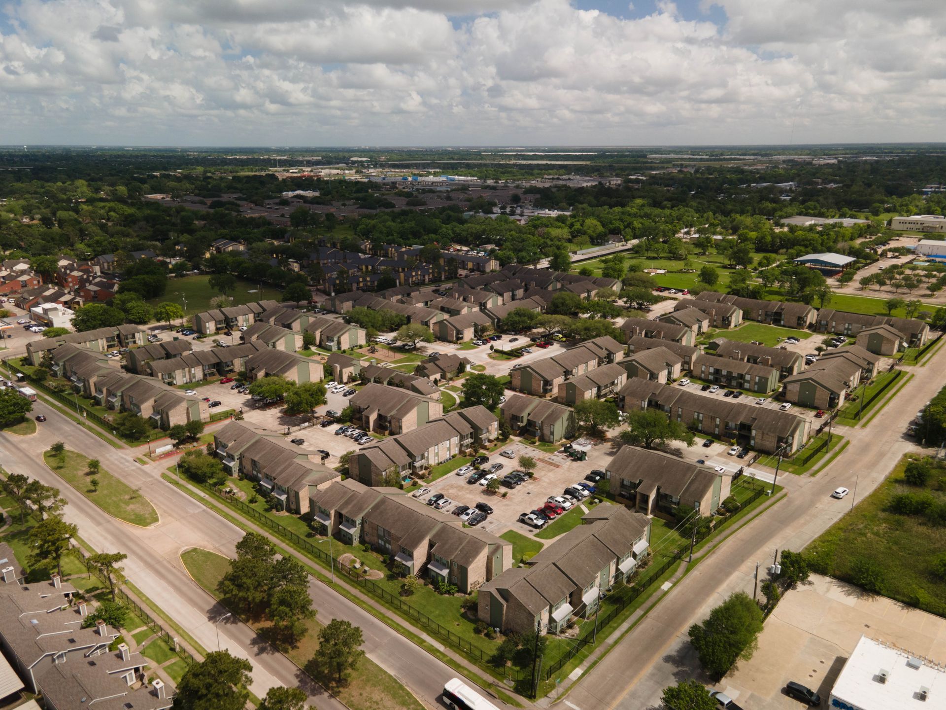An aerial view of a residential area with lots of houses and trees