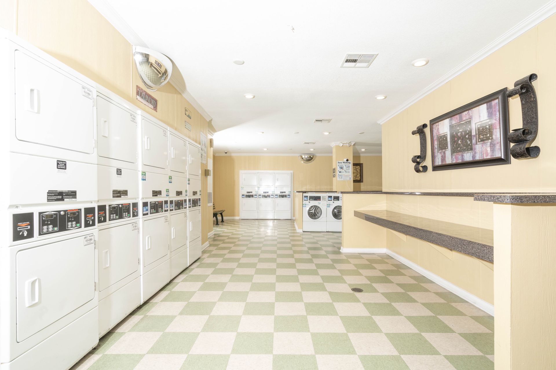 A laundromat with lots of washers and dryers