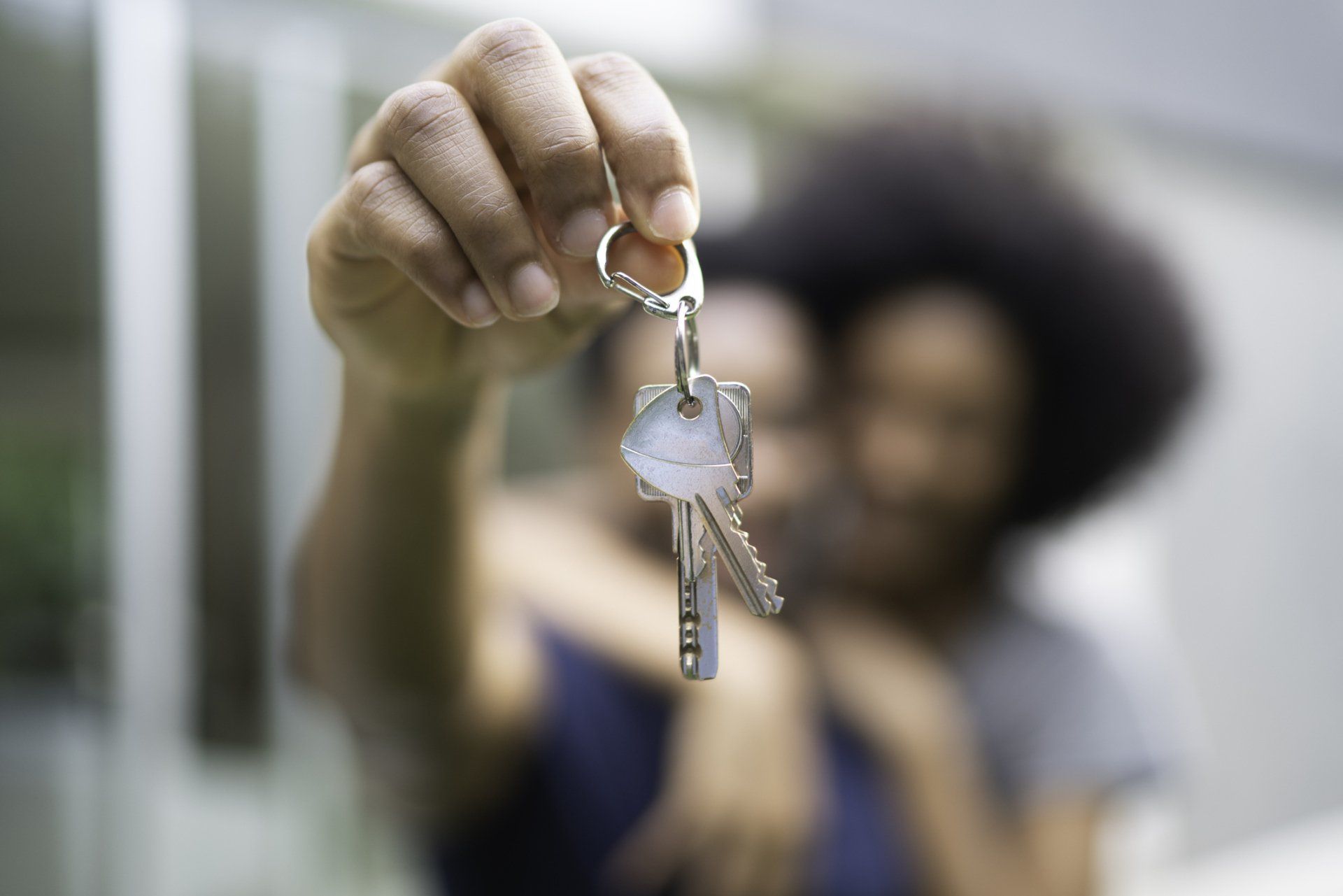 couple holding house keys