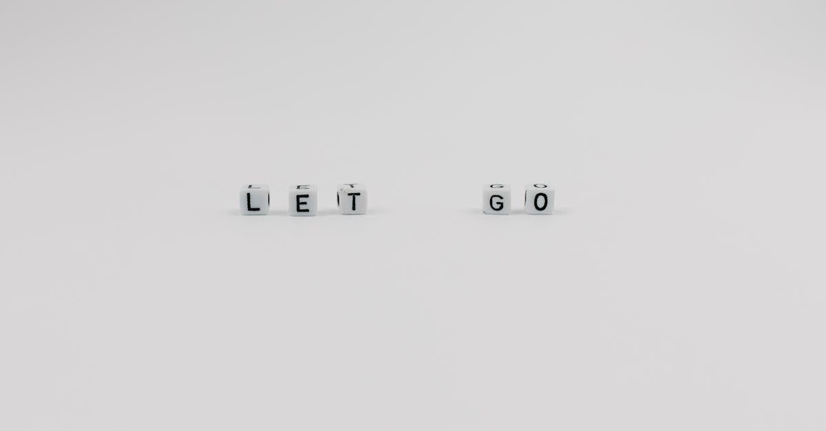 Lettered cubes spelling out let go on a white background