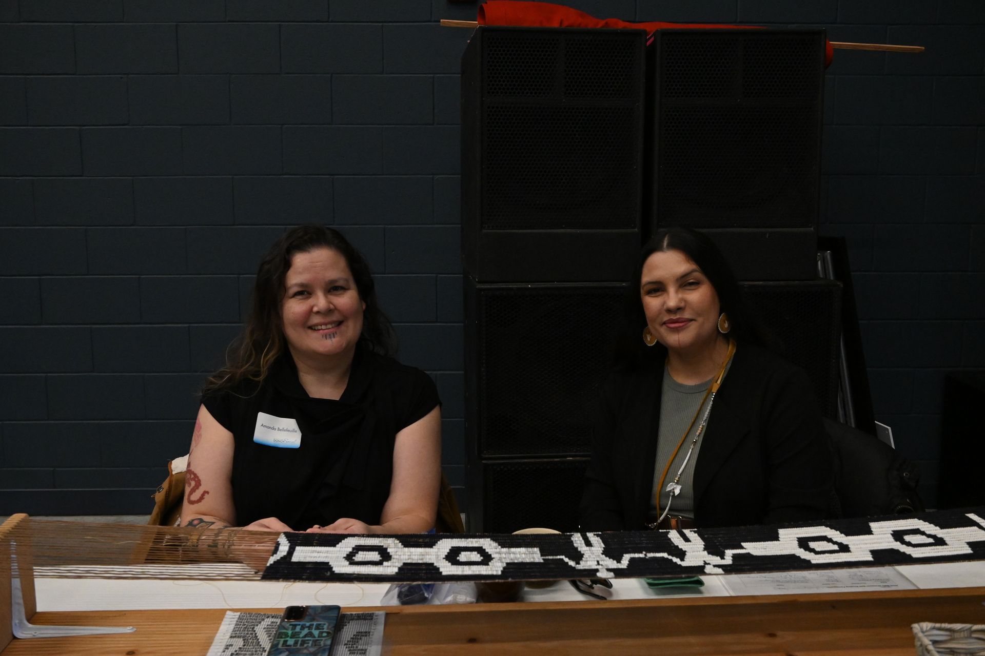 2 Staff members sitting at a table