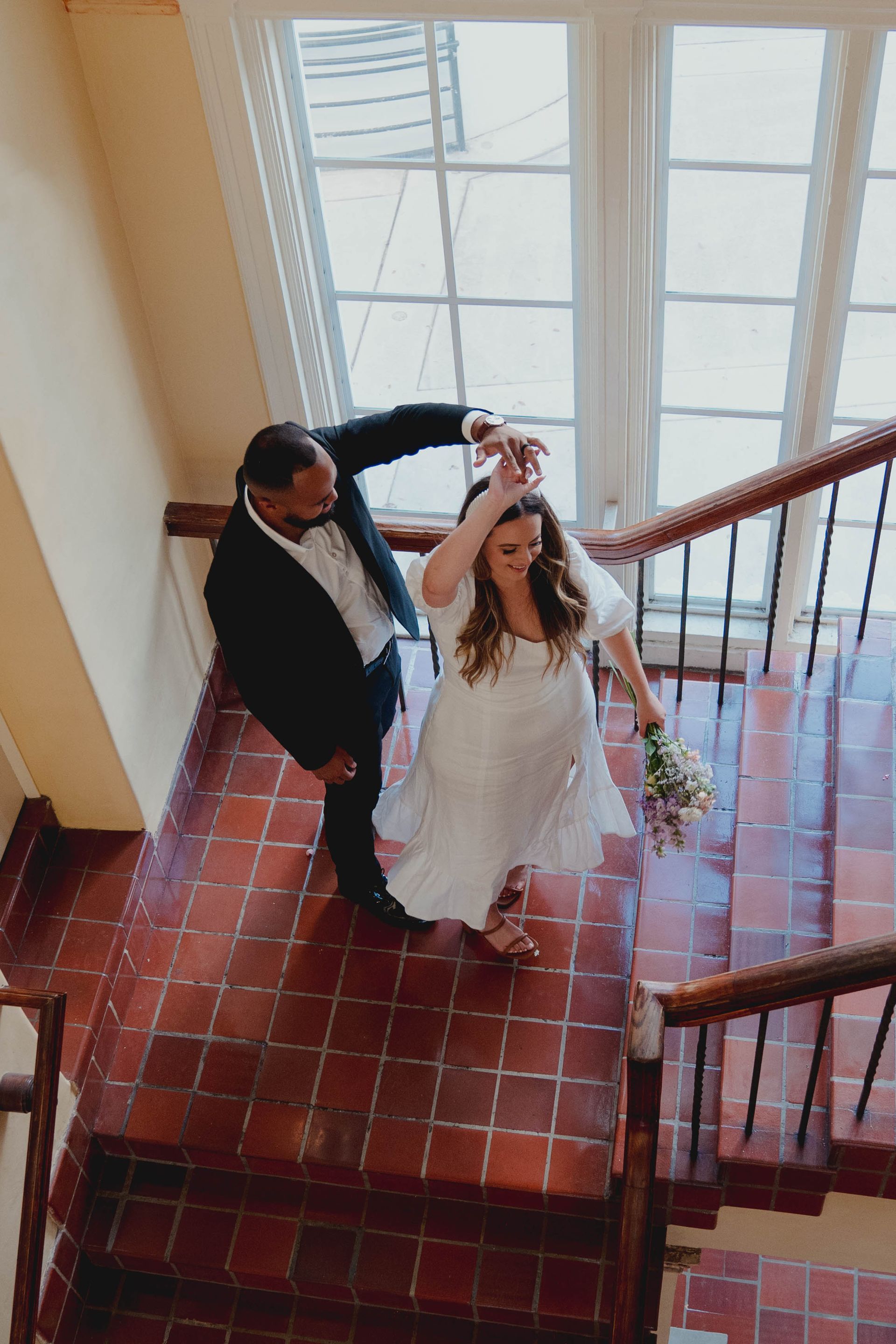 Mr. and Mrs. Delamota dancing in the hallway