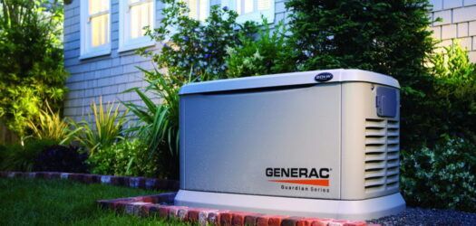 A generac generator is sitting in front of a house.