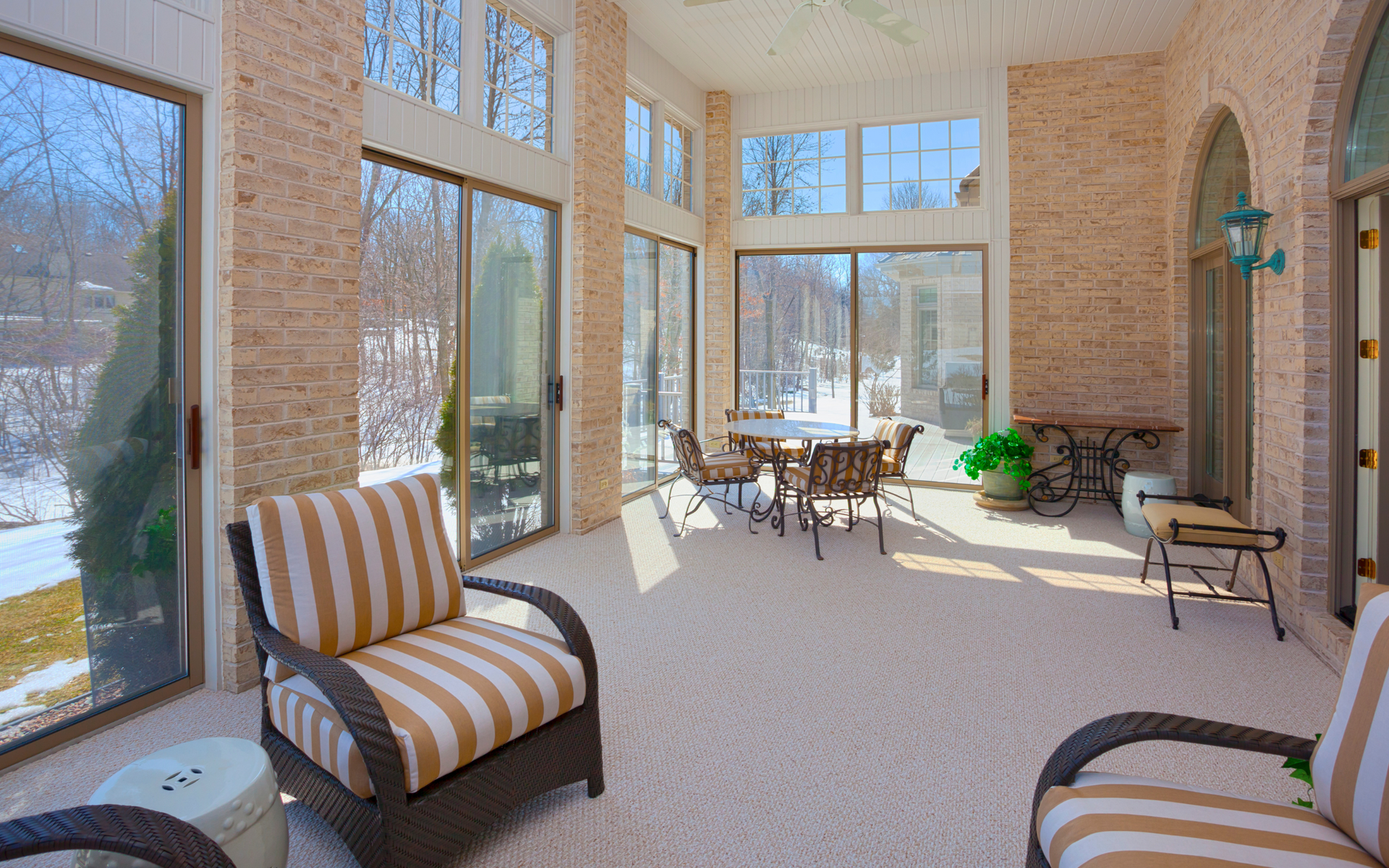 A large room with a lot of windows and furniture.