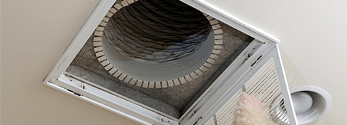 Senior man opening air conditioning filter in ceiling—heater in Brookville, OH Senior man opening air conditioning filter in ceiling—heater in Brookville, OH