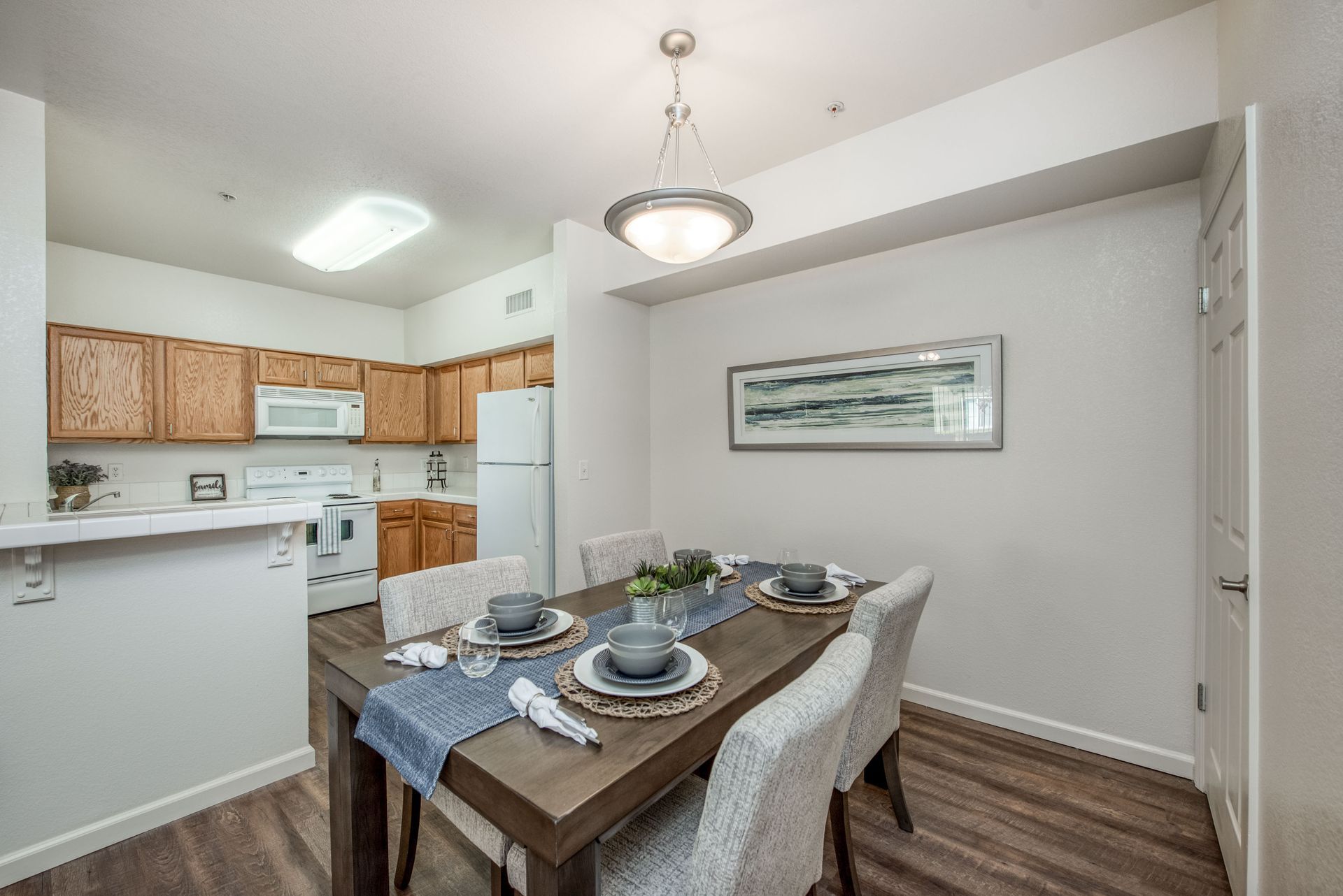 a large building with a pool and umbrellas in front of it