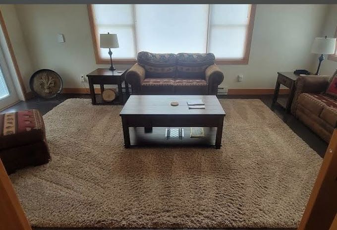 A living room with a couch and a coffee table