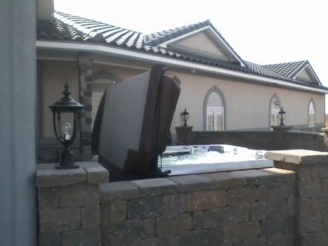 A large house with a hot tub in front of it