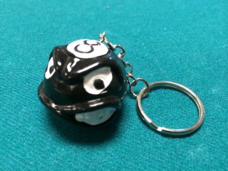 A black and white keychain with the number 3 on it