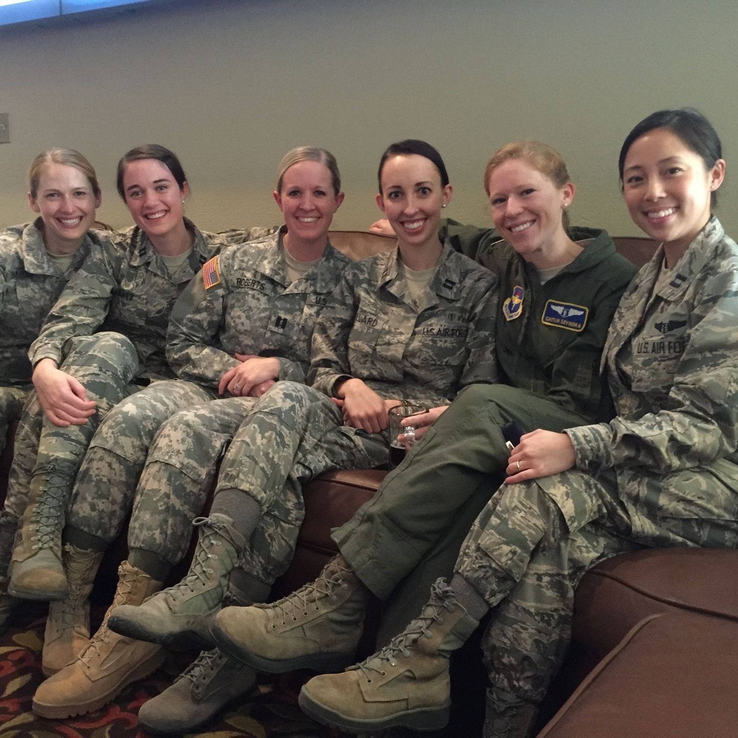 A group of women in military uniforms are posing for a picture
